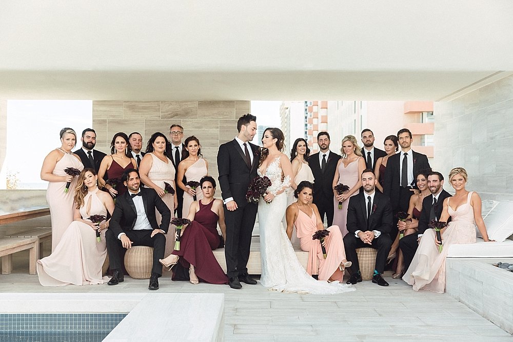 This moody and eclectic wedding at the historical DuPont Building in Miami, Florida is sure to make you swoon. | Wedding Party Goals! This wedding party is dawning different shades of blush, pink, and oxblood in a sophisticated, sexy, setting