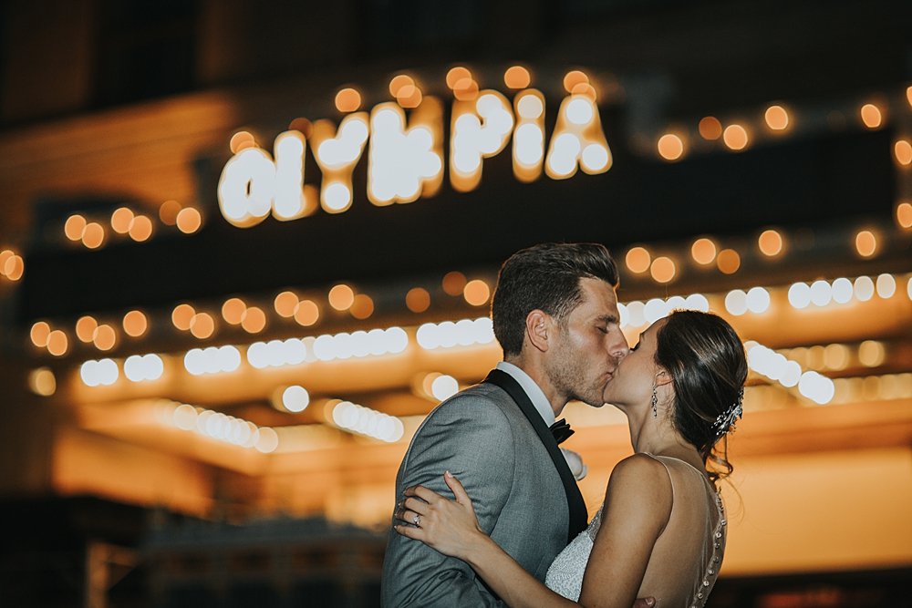 modern-day traditional romance, bride and groom kissing, miami wedding at the Alfred I Dupont Building