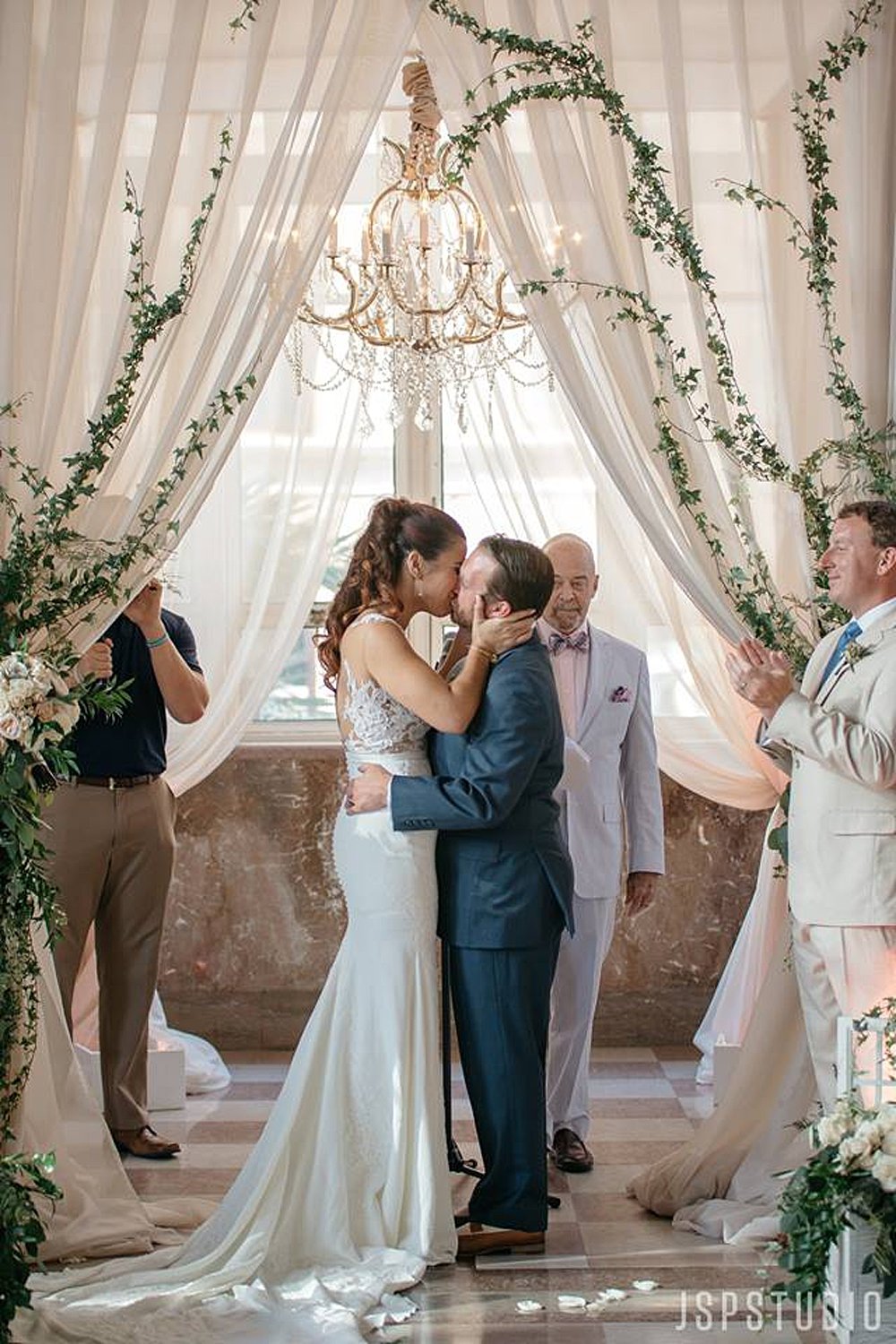 Bride and Groom Kissing at the Alter after being pronounced man and wife | Vintage Garden Wedding at the Historic Alfred I DuPont Building in Miami, FL