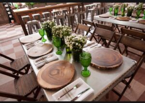 Rustic table setting with plaid linens, an event trend 2025