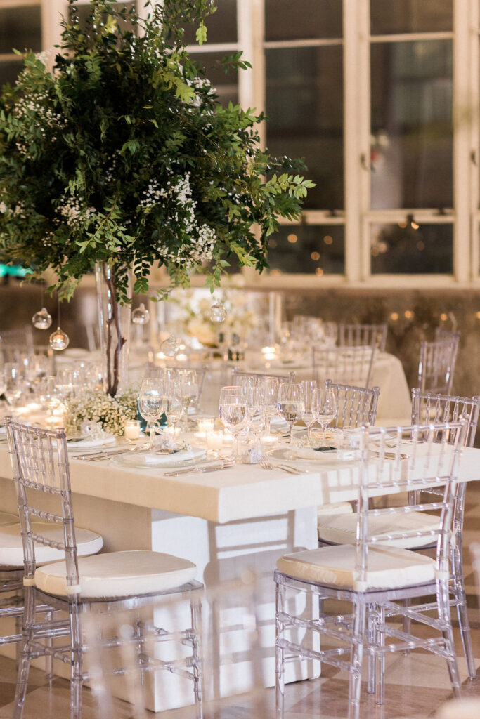 Candlelit wedding reception with white florals in Miami