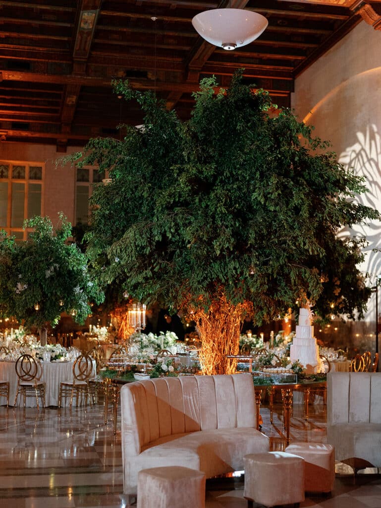 Luxury Miami wedding reception with greenery and candlelight