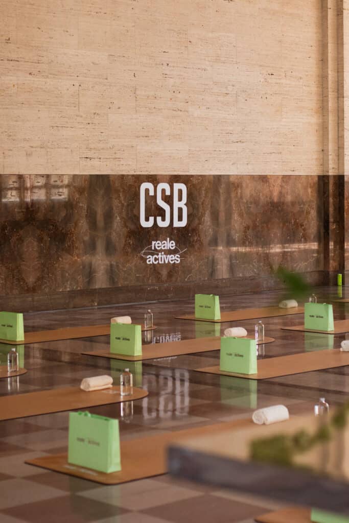 CSBX Reale wellness event setup with branded yoga mats inside the duPont Building Miami