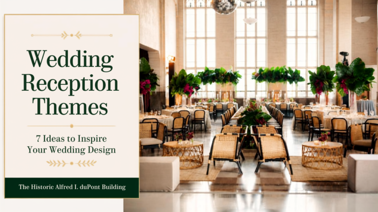 Wedding reception with lush greenery, candlelit tables and chandeliers at The Historic Alfred I. duPont Building.